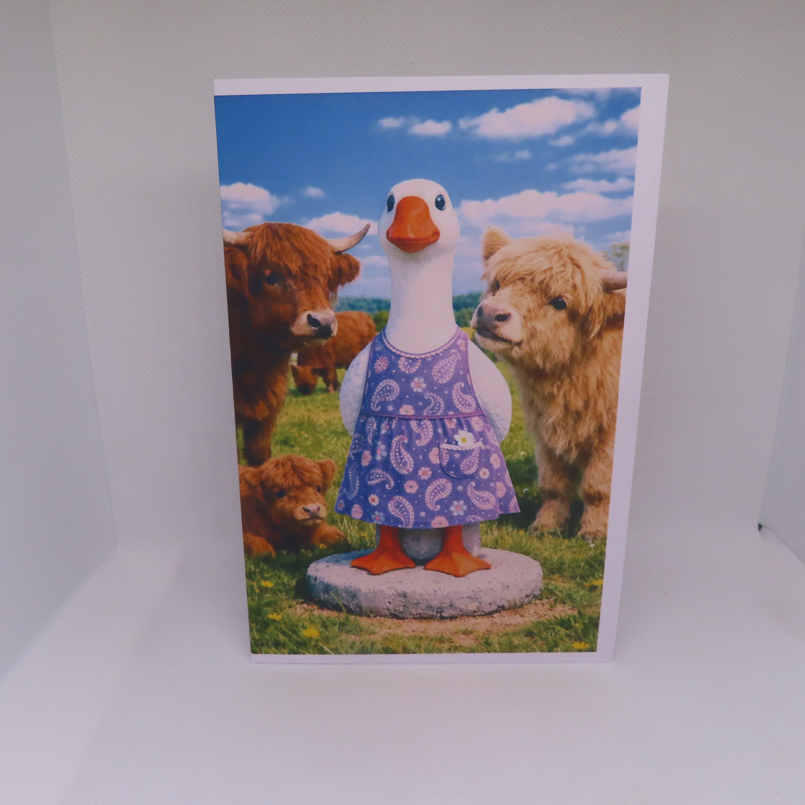 Highland Cow Porch Goose Greeting Card.